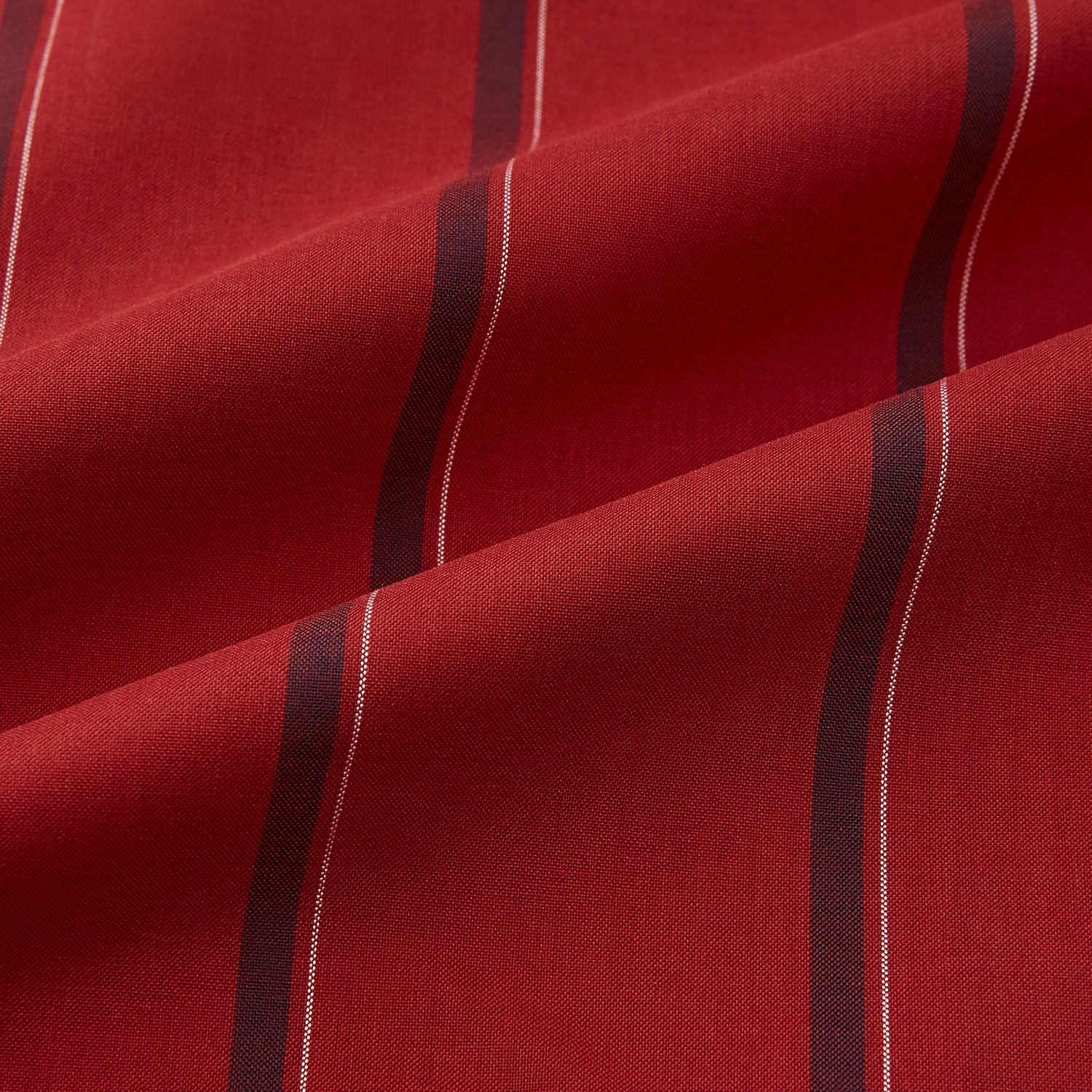 View 6 of product The Turnbull & Asser Dark Red Track Stripe Shirt with Contrast T&A Collar and Cuffs features vertical black stripes, a white collar and cuffs, Mayfair fit, and fine British craftsmanship, shown laid flat on a plain background.