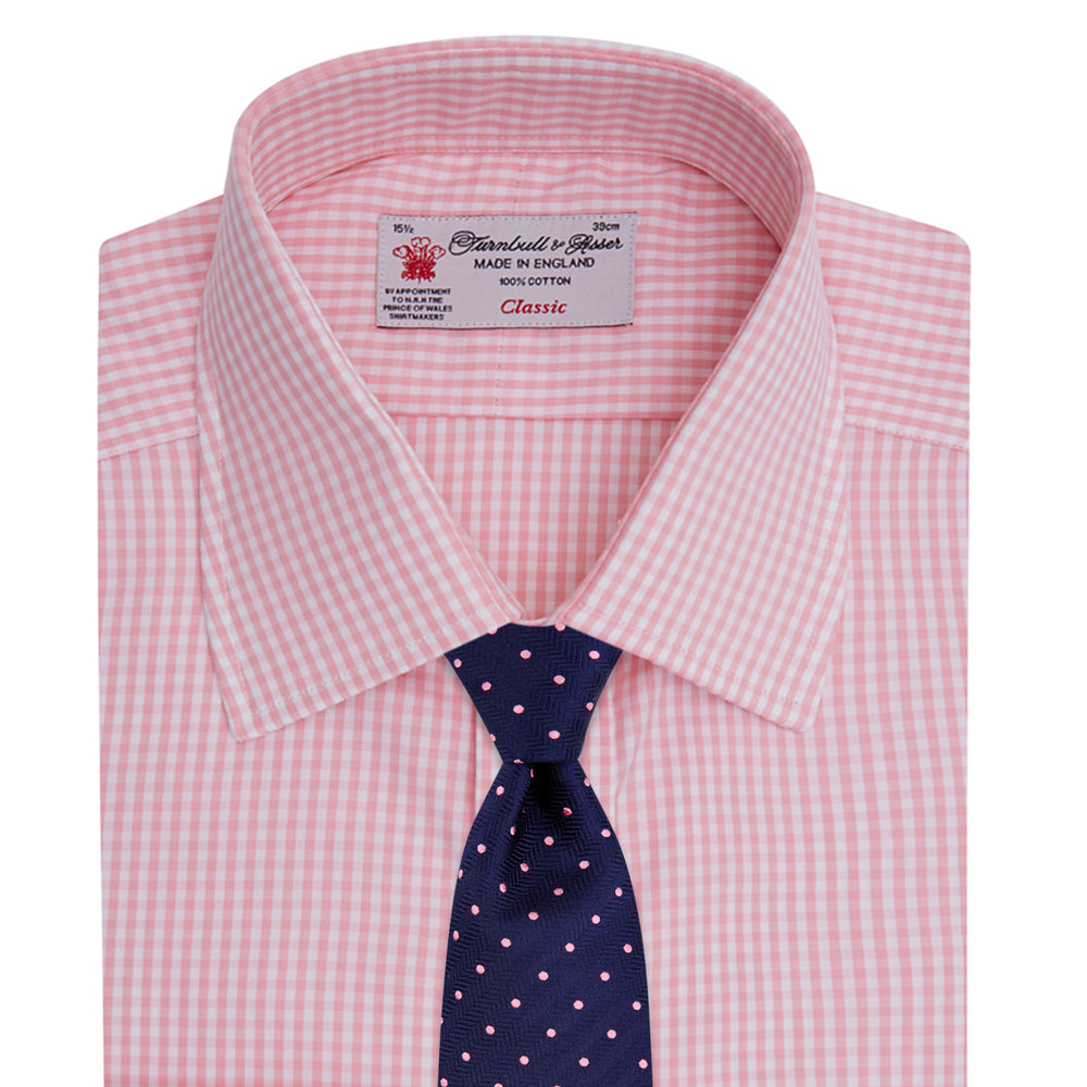 The Turnbull & Asser Light Pink Gingham Check Shirt features a classic T&A collar, 3-button cuffs, and white buttons, neatly folded on a plain white background.