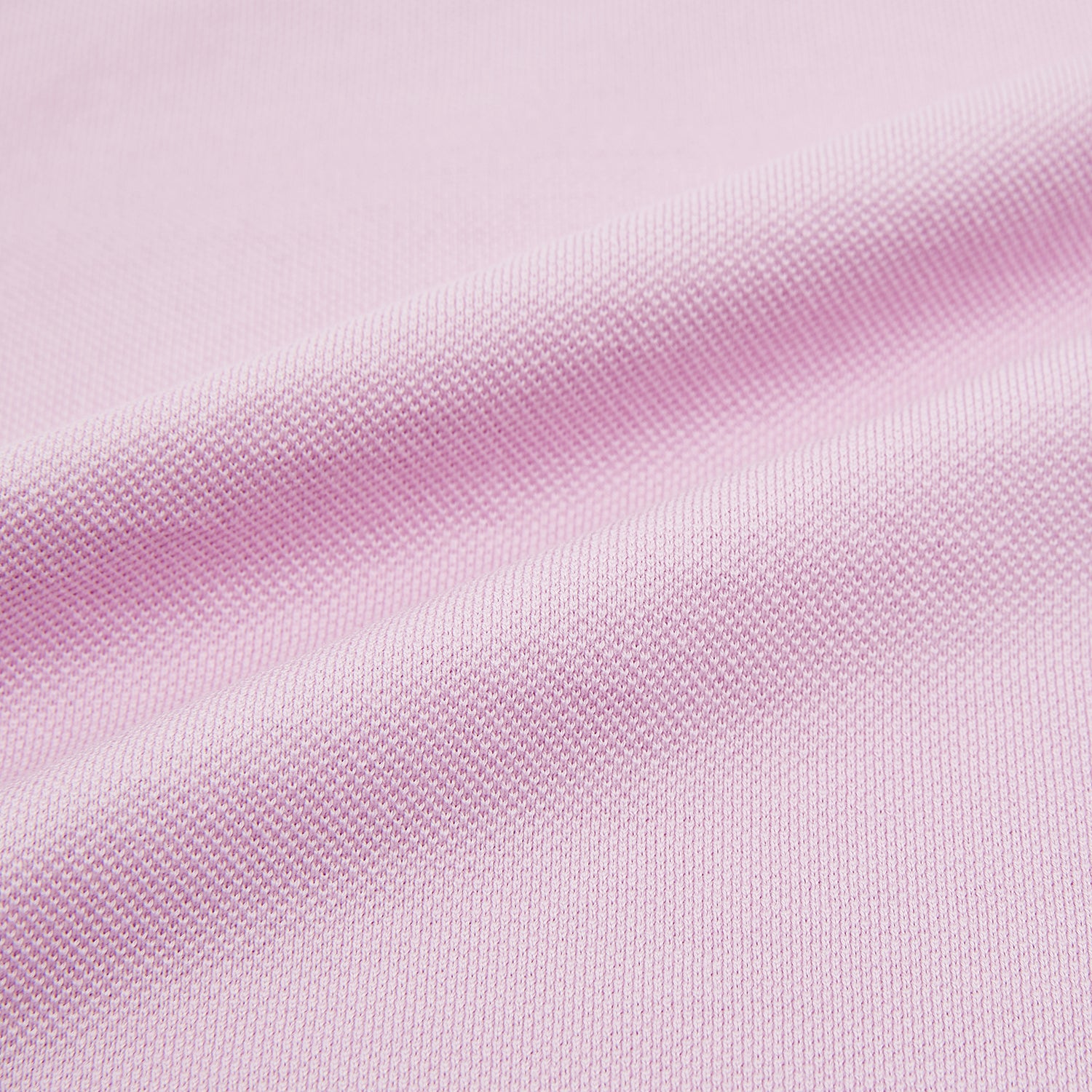 View 5 of product The Turnbull & Asser Pink Polo Shirt is a men's cotton polo with short sleeves, a collar, three dark buttons, and a chest pocket with a button, shown laid flat on a white background.