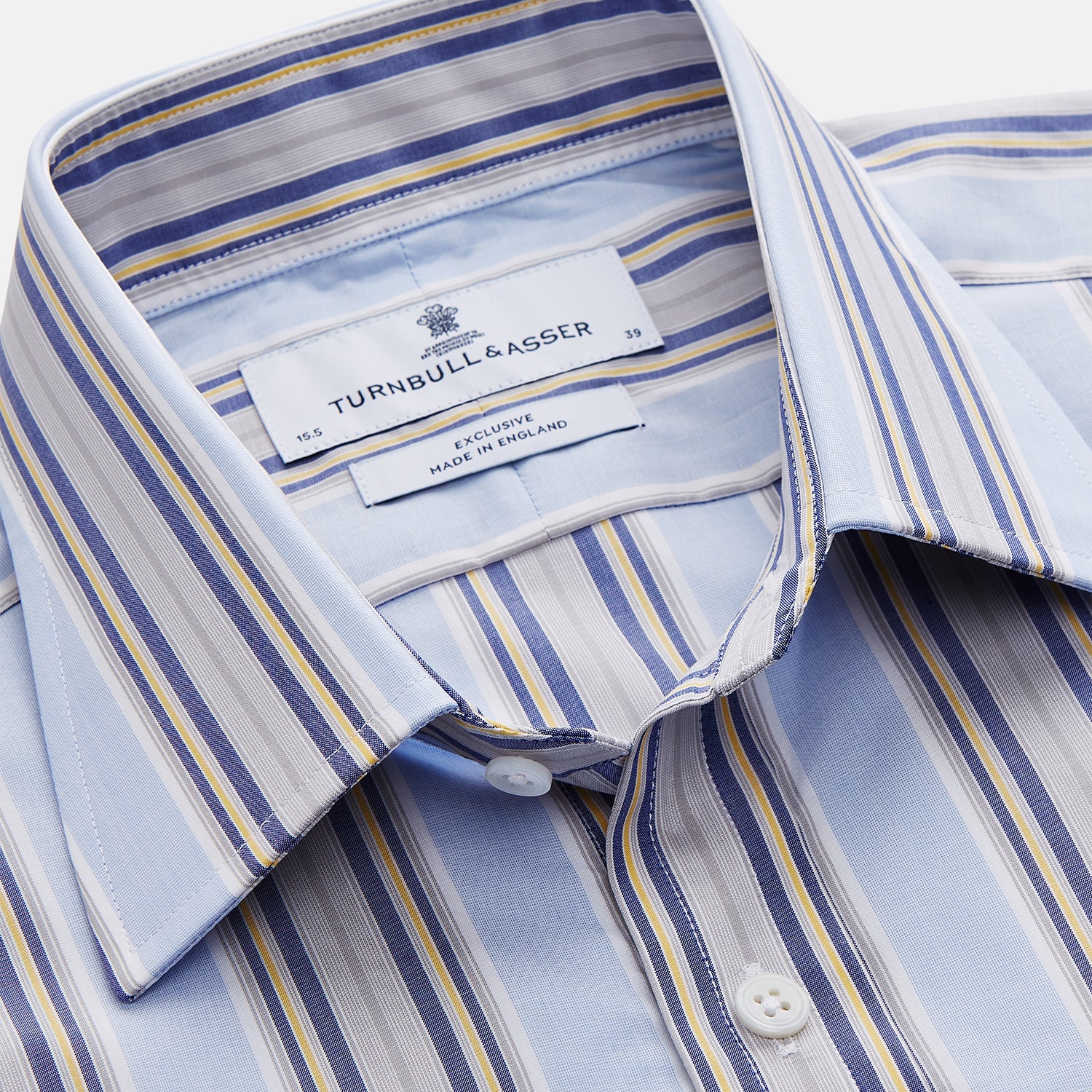 View 2 of product The Turnbull & Asser Pale Blue and Yellow Stripe Cotton Regular Fit Mayfair Shirt is a long-sleeve, button-down formal shirt for men, shown on a plain white background.