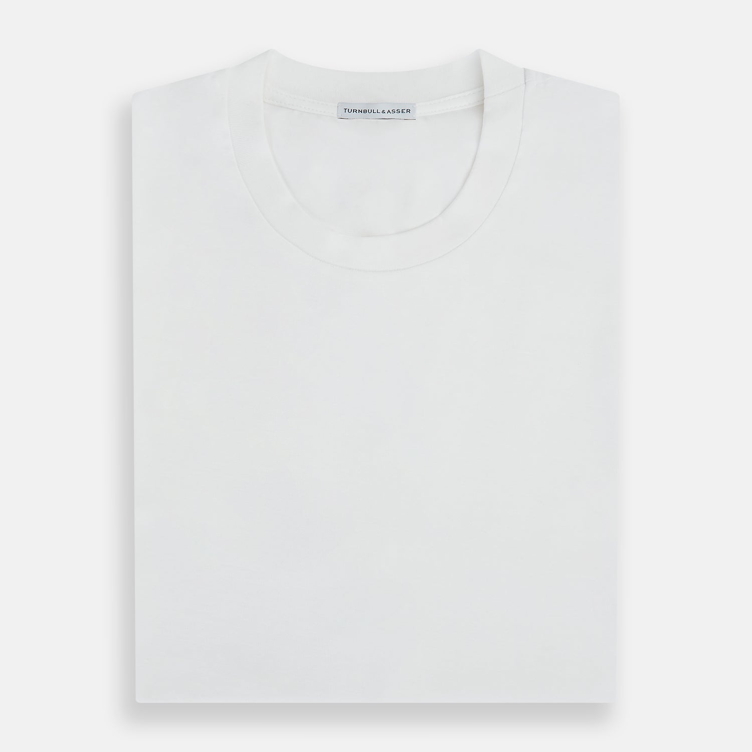 View 5 of product The Turnbull & Asser White Short-sleeve Fitted T-Shirt is a classic, logo-free crew neck laid flat on a white background—perfect for smart casual looks.