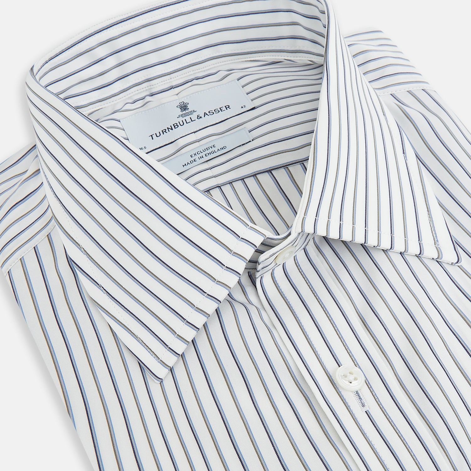 View 2 of product The Turnbull & Asser Brown and Blue Shadow Stripe Mayfair Shirt, featuring long sleeves, a pointed collar, and buttoned cuffs, is crafted from Italian fabric with vertical stripes and shown laid flat on a white background.