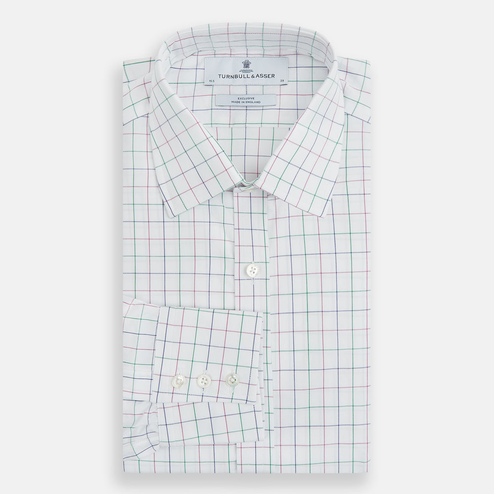 The Turnbull & Asser Pink Grid Check Mayfair Shirt is a long-sleeve, button-down shirt with a T&A collar, crafted from organic cotton and featuring a pink checkered grid pattern on white with buttoned cuffs.