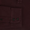 View 4 of product The Turnbull & Asser Burgundy Rugby Polo Shirt is a long-sleeve, pure cotton collared top with no visible buttons, shown laid flat on a white background.