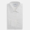 View 5 of product The Turnbull & Asser White Pleated Cotton Dress Shirt features a T&A collar, pleated front, double cuffs, and a button-down front, shown laid flat against a white background.