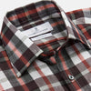 View 2 of product The Turnbull & Asser Black Multi-check Linen Blend Regular Fit Mayfair Shirt features long sleeves, a classic T&A collar and cuffs, and a black-and-red check pattern, shown on a white background.