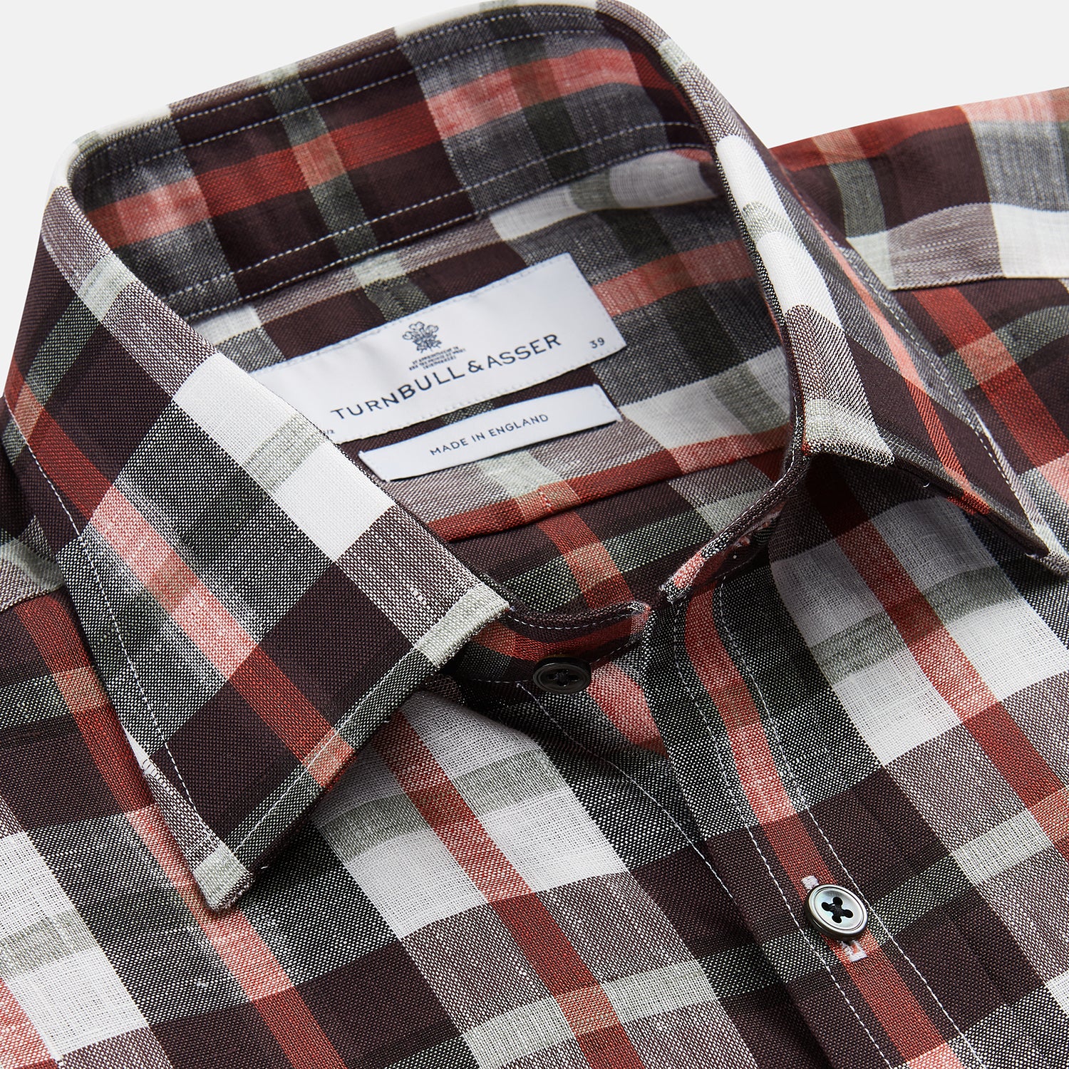 View 2 of product The Turnbull & Asser Black Multi-check Linen Blend Regular Fit Mayfair Shirt features long sleeves, a classic T&A collar and cuffs, and a black-and-red check pattern, shown on a white background.