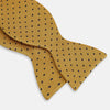 View 3 of product The Navy and Yellow Micro Dot Silk Bow Tie by Turnbull & Asser features a refined dot pattern—an ideal accessory for elevating sophisticated outfits.
