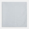 View 1 of product The Turnbull & Asser Hand Rolled Pale Blue Graph Check Handkerchief features a neatly folded white cotton design with a pale blue check, offering an elegant finishing touch to any setting.