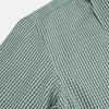 View 6 of product The MELON GREEN MICRO SHADOW CHECK WESTMINSTER SHIRT by Turnbull & Asser is a long-sleeved, button-up shirt with a green and white checkered pattern, pointed collar, and buttoned cuffs, shown on a white background.