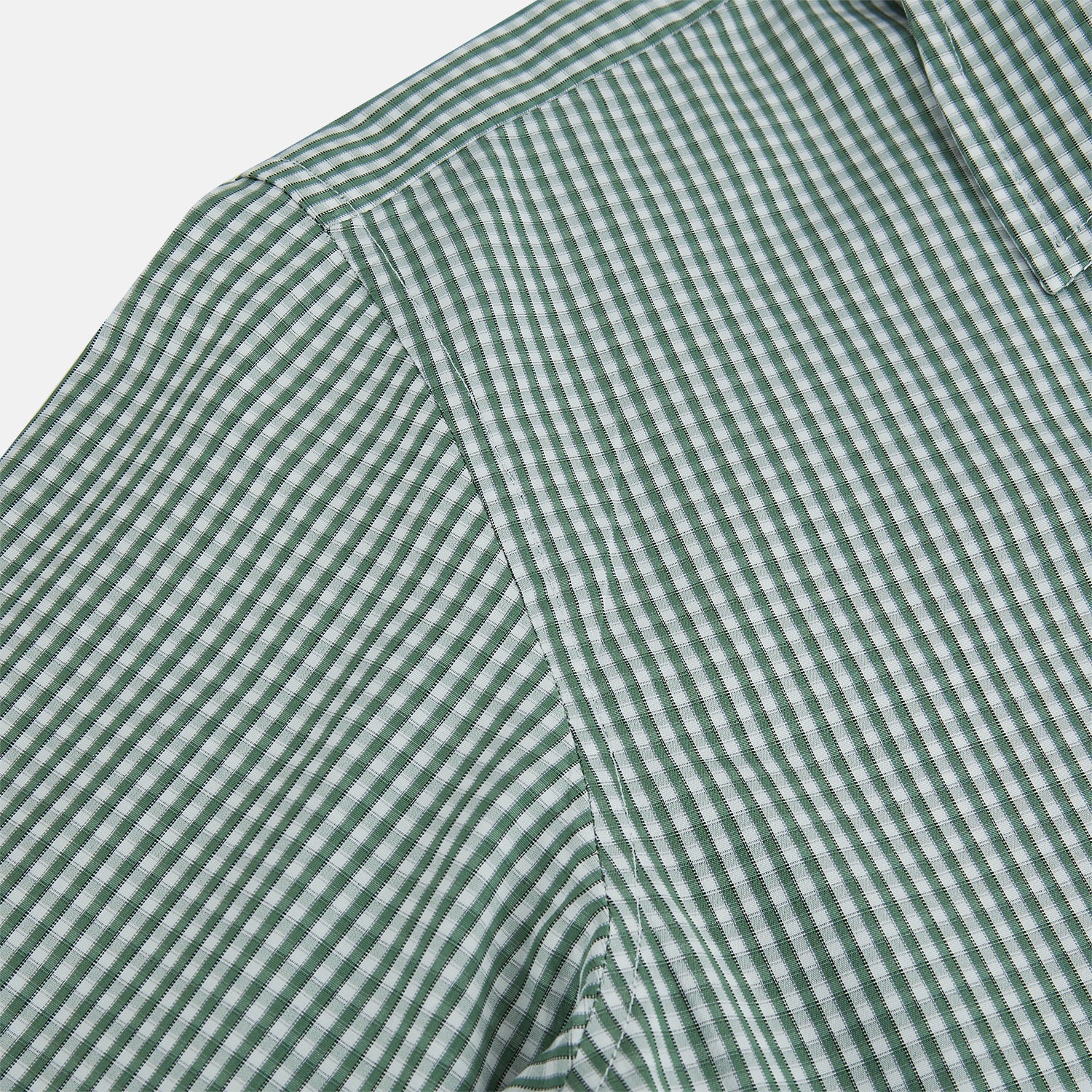 View 6 of product The MELON GREEN MICRO SHADOW CHECK WESTMINSTER SHIRT by Turnbull & Asser is a long-sleeved, button-up shirt with a green and white checkered pattern, pointed collar, and buttoned cuffs, shown on a white background.