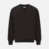 View 1 of product The Turnbull & Asser Dark Brown Cashmere V-Neck Jumper features long sleeves, ribbed cuffs, and a ribbed hem—timeless knitwear shown on a white background, perfect for elevating any wardrobe.