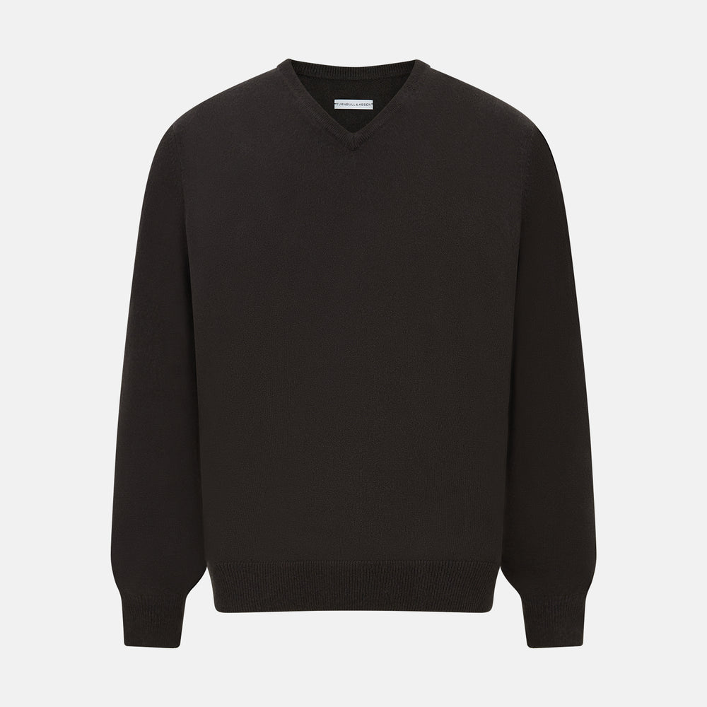 The Turnbull & Asser Dark Brown Cashmere V-Neck Jumper features long sleeves, ribbed cuffs, and a ribbed hem—timeless knitwear shown on a white background, perfect for elevating any wardrobe.