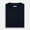 View 4 of product The Turnbull & Asser Navy Cashmere Round Neck Jumper for men is shown against a white background, featuring long sleeves, a relaxed fit, and ribbed cuffs, hem, and collar for an effortlessly elegant look.