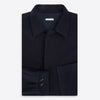 View 5 of product The Turnbull & Asser Navy Greenwich Knitted Overshirt, made from Italian wool with a collar, two front flap pockets, and a hidden button placket, is shown laid flat on a white background.