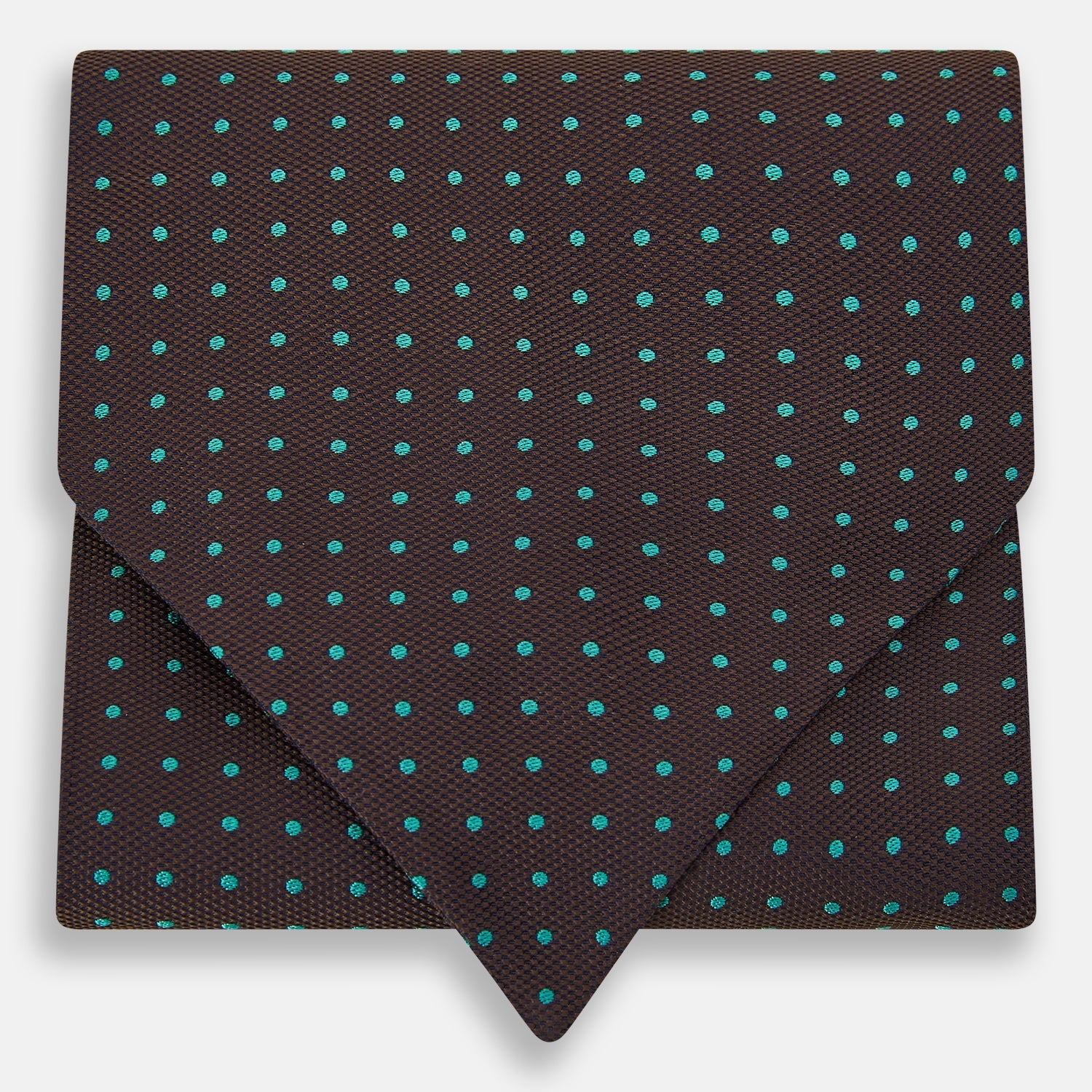 View 1 of product The Turnbull & Asser Blue and Dark Brown Micro Dot Silk Cravat features evenly spaced blue micro dots on dark brown silk, displayed neatly folded on a white background.