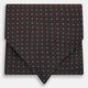 The Turnbull & Asser Blue and Dark Brown Micro Dot Silk Cravat features evenly spaced blue micro dots on dark brown silk, displayed neatly folded on a white background.
