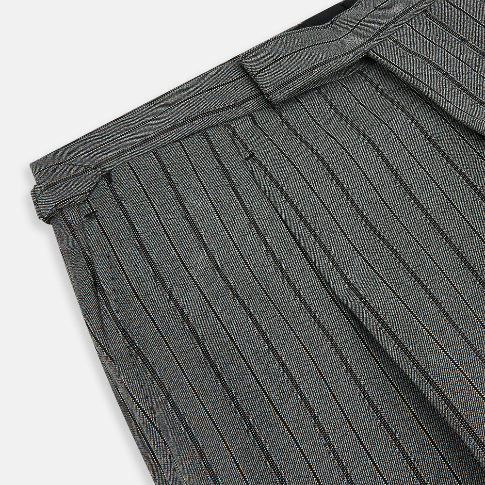 The Grey Multi Pinstripe Morning Dress Trousers by Turnbull & Asser feature a tailored fit, vertical black pinstripes, and a flat front design—ideal for formal wear. Shown against a plain white background.