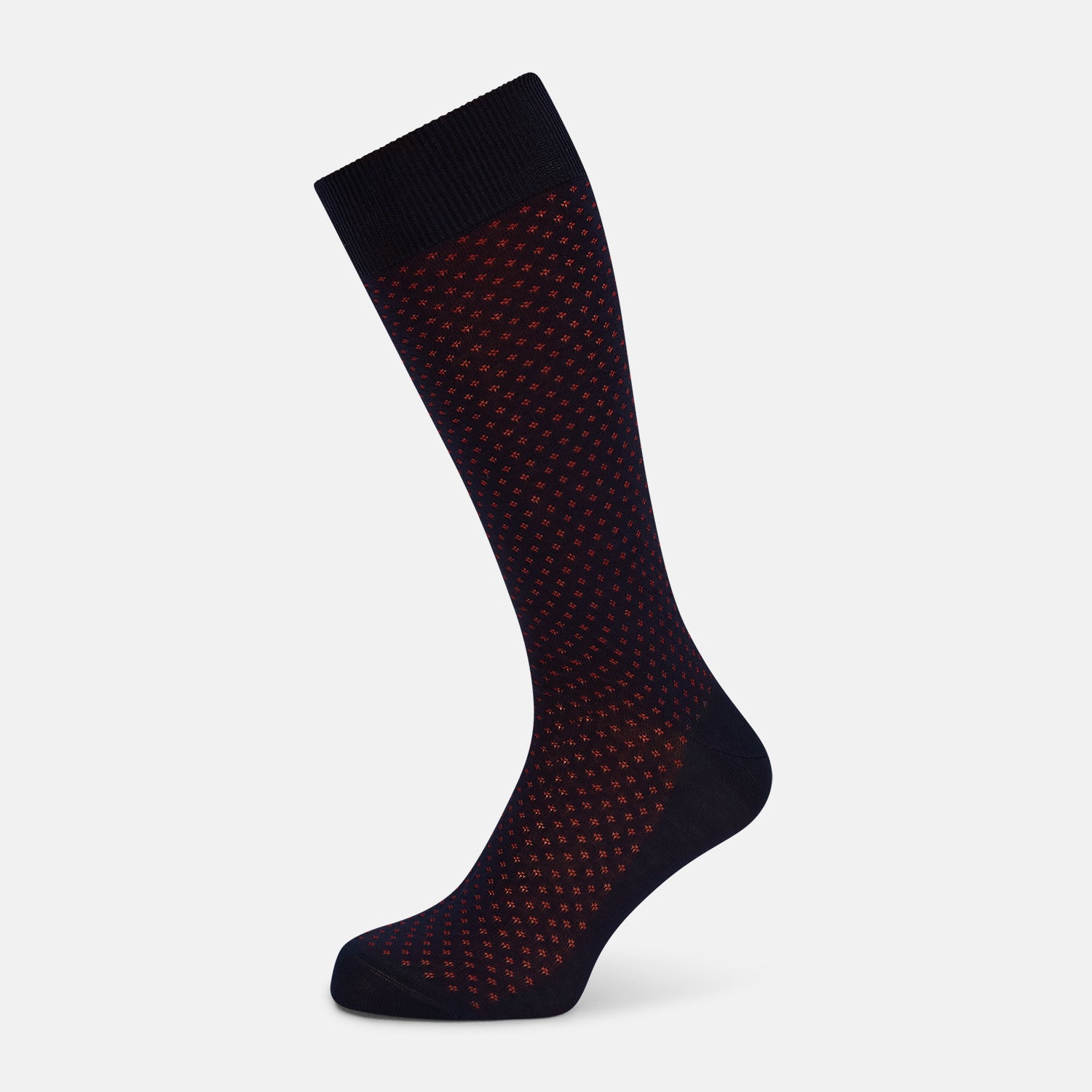 View 1 of product A single Navy/Red Motif Mid-Length Sock by Turnbull & Asser, displayed upright on a white background. The sock features a calf-length style, ribbed cuff, hand-linked toe for comfort, and a subtle red pattern.