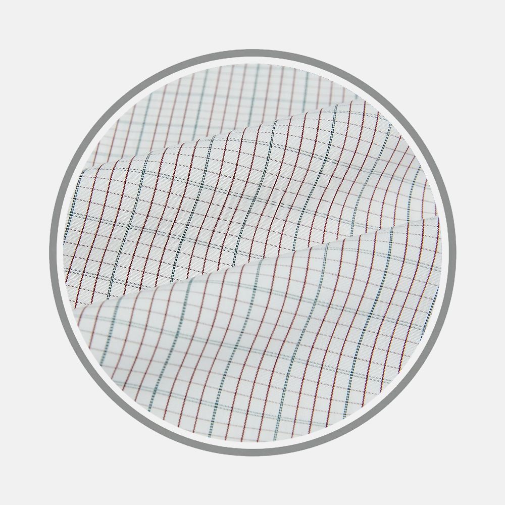 Close-up of Turnbull & Asser’s Burgundy And Green Double Grid Check Fabric, showing a white base with fine burgundy and green intersecting lines in a grid pattern, displayed within a circular frame on a plain background.