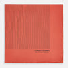 View 3 of product The Orange Stripe Silk Pocket Square by Turnbull & Asser features thin black vertical lines and "TURNBULL & ASSER HAND PRINTED IN ENGLAND" in the corner, neatly folded on a white background.