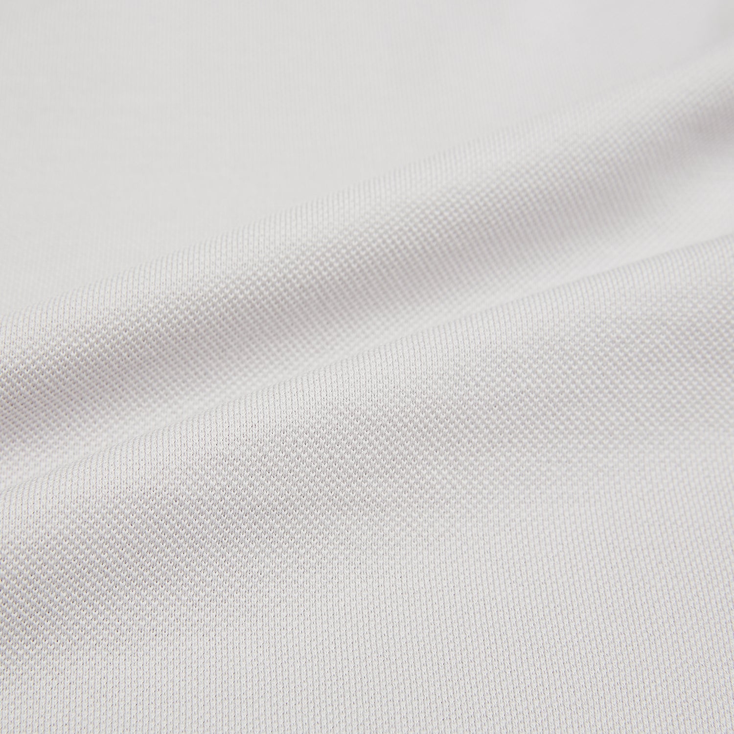 View 5 of product The Turnbull & Asser Pale Pink Polo Shirt is a cotton jersey short-sleeve polo with a collar, three brown buttons on the placket, and a button-flap chest pocket, shown against a white background.
