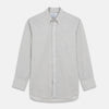 View 1 of product A Grey Fine Check Cotton Blend Weekend Fit Suffolk Shirt by Turnbull & Asser with long sleeves, a collar, and single chest pocket is laid flat on a white background.