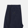 View 5 of product Turnbull & Asser's Light Navy Corduroy Miles Trousers feature a straight-leg stretch fit, elasticated waist, and matching fabric drawstring, shown on a plain white background.