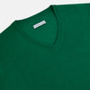 View 2 of product The Turnbull & Asser Hunter Green Fine Merino V-Neck Jumper is displayed against a white background, highlighting classic knitwear style.