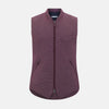 View 1 of product The Turnbull & Asser Burgundy Pin Check Padded Gilet features a front zipper, two zippered side pockets, a chest pocket, and a rounded hem—an ideal men’s layering piece shown on a white background.