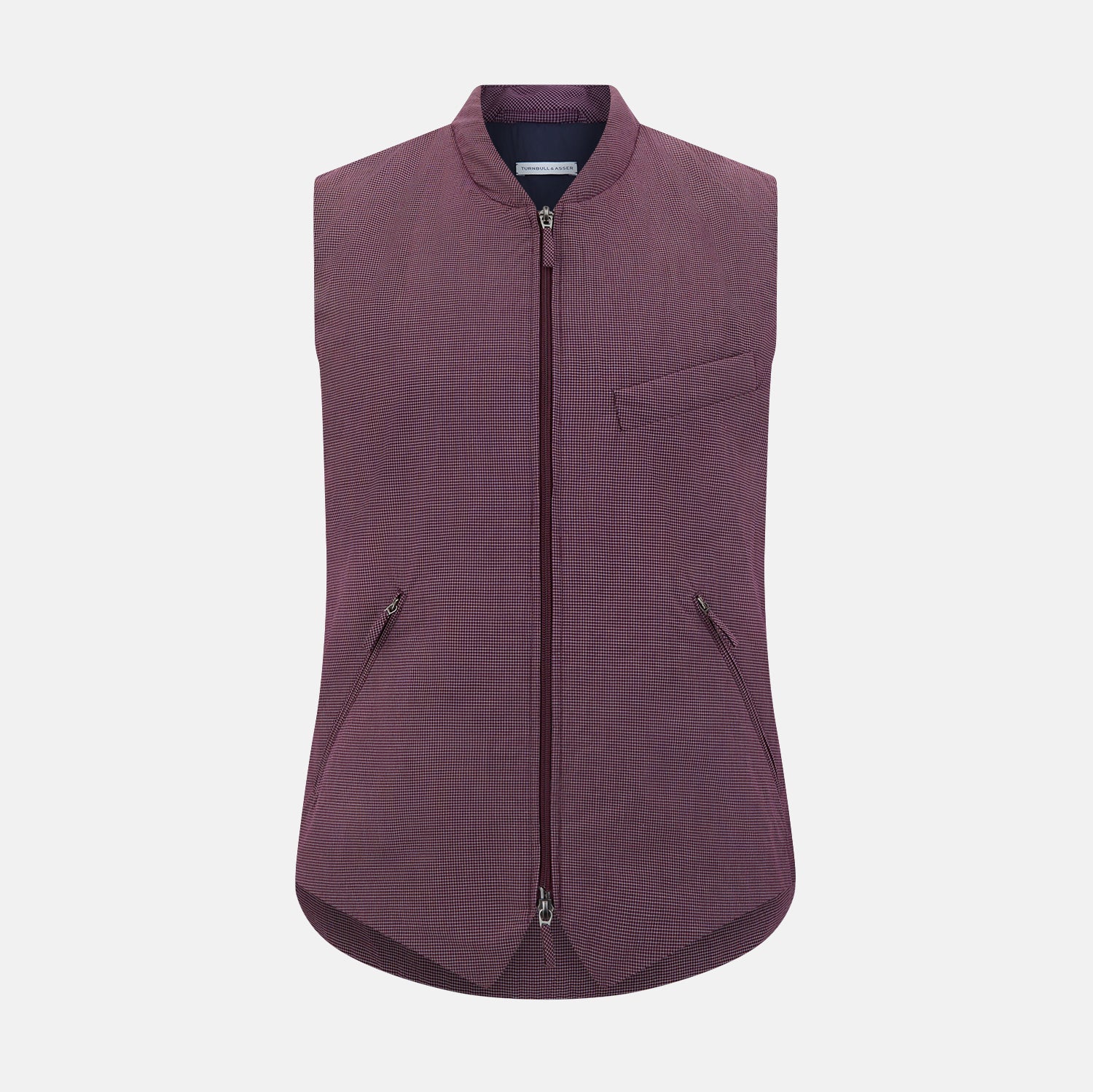 View 1 of product The Turnbull & Asser Burgundy Pin Check Padded Gilet features a front zipper, two zippered side pockets, a chest pocket, and a rounded hem—an ideal men’s layering piece shown on a white background.