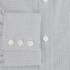 View 4 of product The Midnight Blue Micro Tattersall Check Mayfair Shirt by Turnbull & Asser, made from pure cotton with white buttons, a classic collar, and cuffed sleeves, is laid flat on a white background.