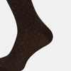 View 4 of product A single Turnbull & Asser Dark Chocolate/Blue Pale Dot Mid-Length Sock is displayed upright against a plain white background.