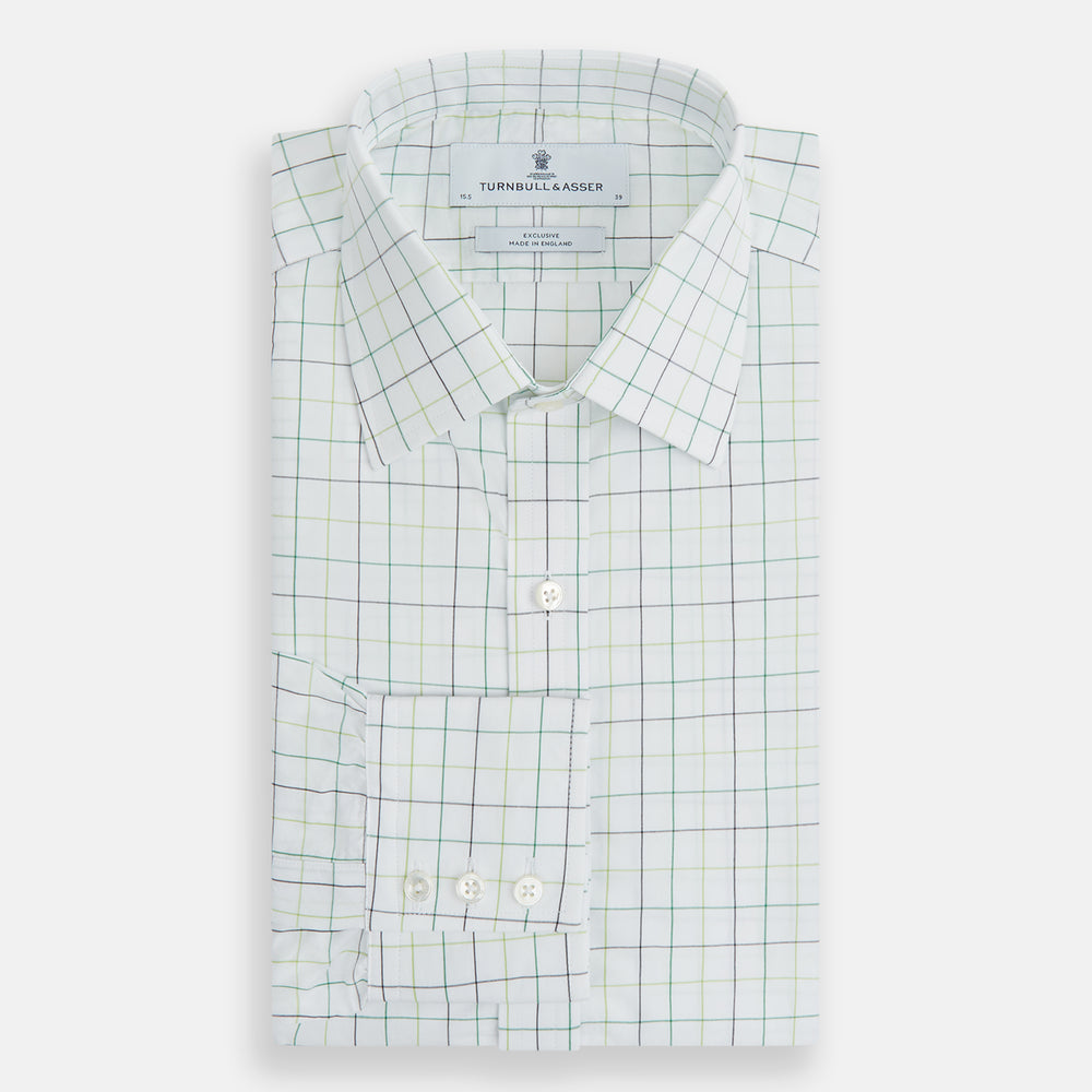 The Turnbull & Asser Dark Green Grid Check Mayfair Shirt features a white base with blue and dark green checks, a classic T&A collar, buttoned cuffs, and a Mayfair fit. The long-sleeve shirt is shown laid flat on a white background.