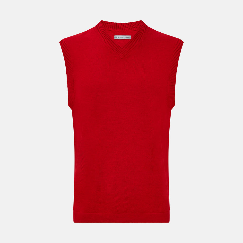 The Turnbull & Asser Red Fine Merino V-Neck Vest is a men's sleeveless jumper featuring ribbed edges, showcased against a plain white background.
