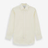 View 1 of product The Tomorrow Never Dies Cream Cotton Hamburg Shirt by Turnbull & Asser is a classic, cream-colored, long-sleeved button-up with a traditional collar and buttoned cuffs—just like the one worn by James Bond.
