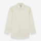 The Tomorrow Never Dies Cream Cotton Hamburg Shirt by Turnbull & Asser is a classic, cream-colored, long-sleeved button-up with a traditional collar and buttoned cuffs—just like the one worn by James Bond.