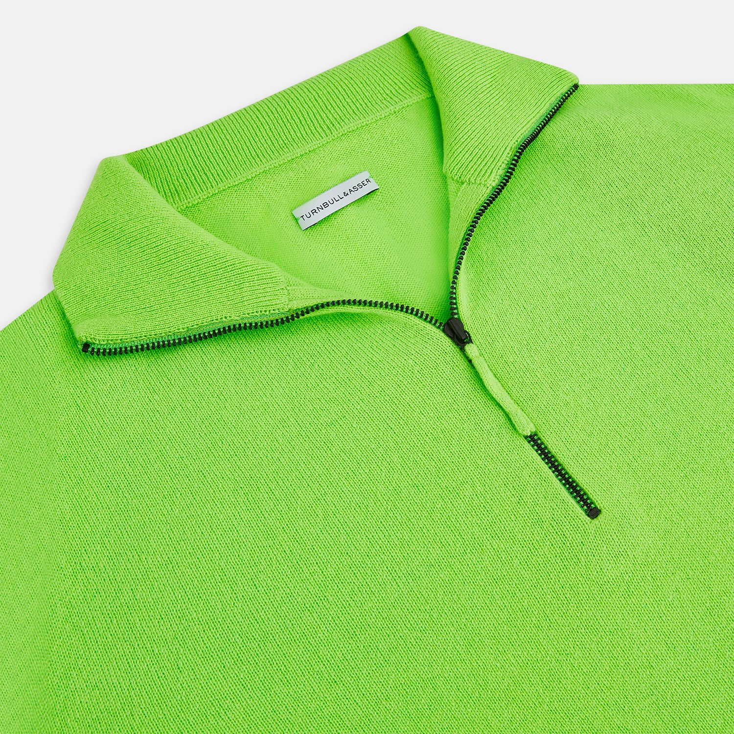 View 2 of product The Turnbull & Asser Neon Green Half-Zip Cashmere Jumper features long sleeves, a high collar, and front half-zip closure—ideal knitwear for bold style, shown on a white background.