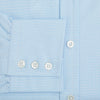 View 4 of product The Pale Blue Rhombus Mayfair Shirt by Turnbull & Asser features long sleeves, a classic collar, white buttons, and buttoned cuffs, shown laid flat on a white background.
