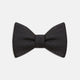 The Turnbull & Asser Black Herringbone Silk Bow Tie, ideal for formal occasions, features a subtle herringbone pattern and is shown against a plain white background.
