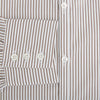 View 4 of product The Turnbull & Asser Coffee Multi Stripe Westminster Shirt features long sleeves, a button-up front, subtle beige and white stripes, a pointed Turnbull collar, and buttoned cuffs—expertly crafted in Britain and shown flat on a white background.