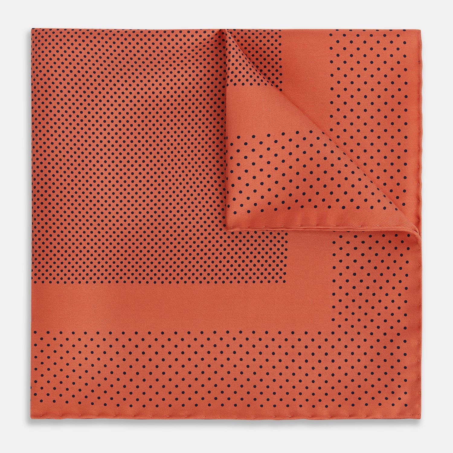 View 1 of product The Orange Dot Silk Pocket Square by Turnbull & Asser is handmade in England from silk, featuring small black polka dots and a solid orange border with a folded corner.