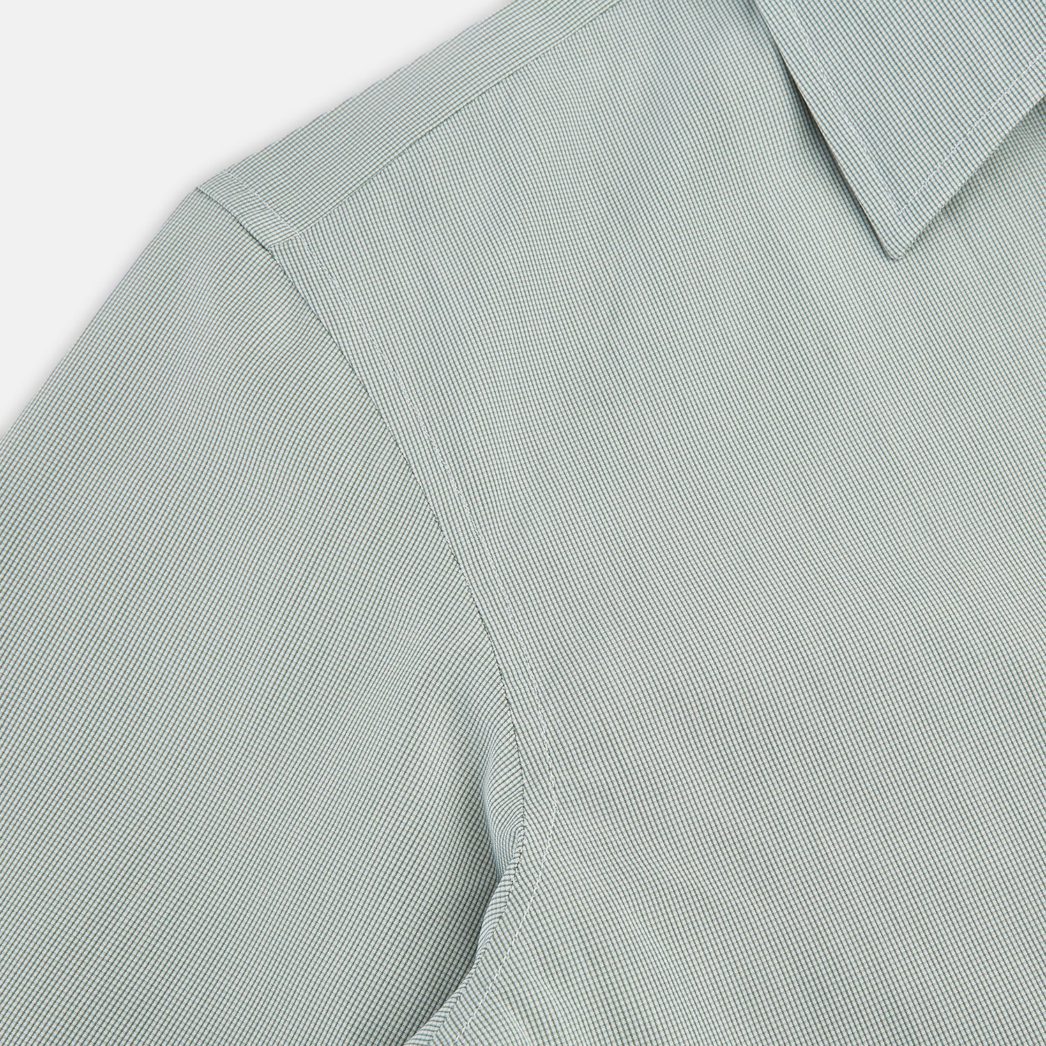 View 6 of product A dark green micro graph check Westminster shirt by Turnbull & Asser, featuring fine British craftsmanship, a Turnbull collar, and white buttons, is laid flat on a white background.