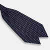 View 3 of product The White Dot and Navy Silk Cravat by Turnbull & Asser features evenly spaced white polka dots on navy silk—a classic accessory ideal for adding British elegance to any look.