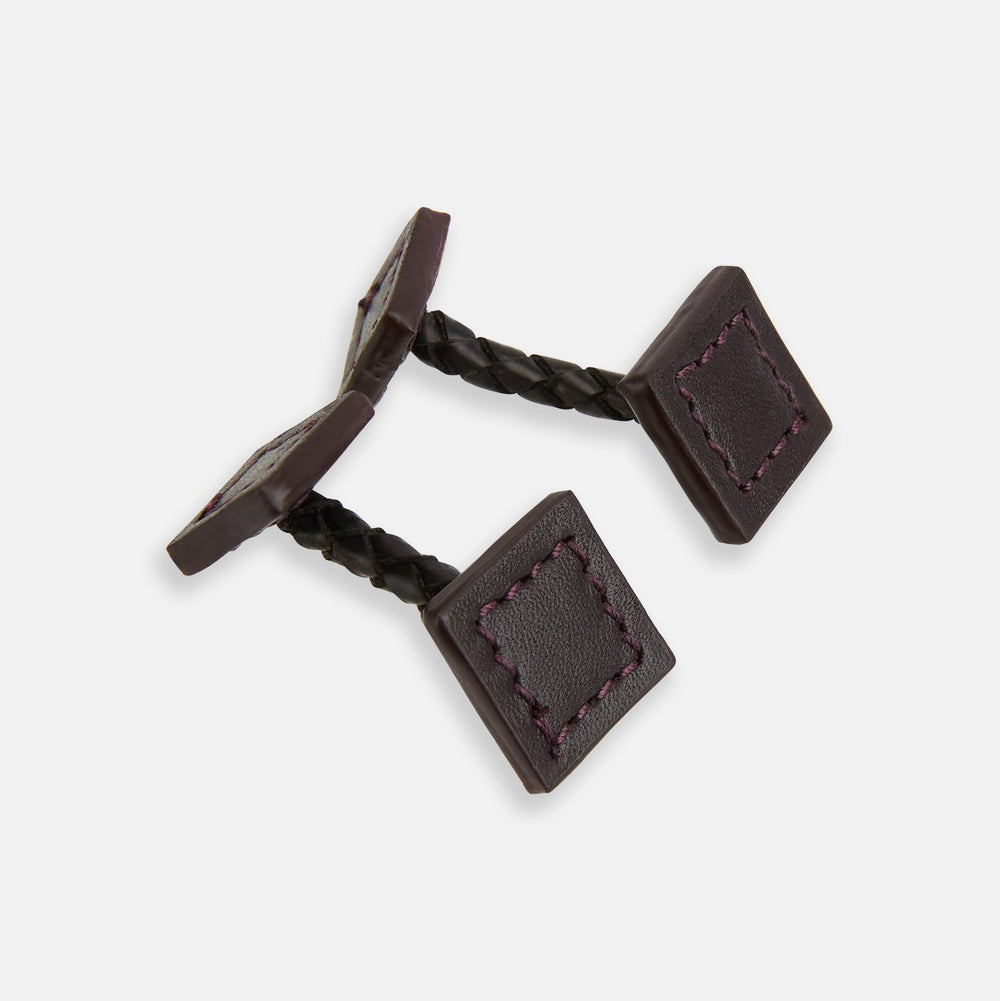 The Burgundy Leather Cufflinks by Turnbull & Asser feature square Italian leather with visible edge stitching and braided loops, presented on a white background—an elegant addition to men's accessories.