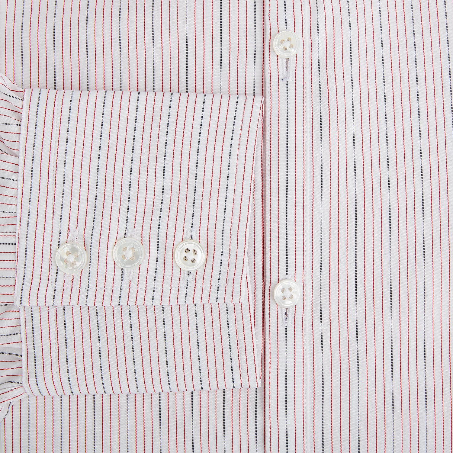View 4 of product The Red Hairline Stripe Westminster Shirt by Turnbull & Asser features a pointed collar and thin vertical stripes in a light hue, displayed flat against a white background—a fine example of British craftsmanship.