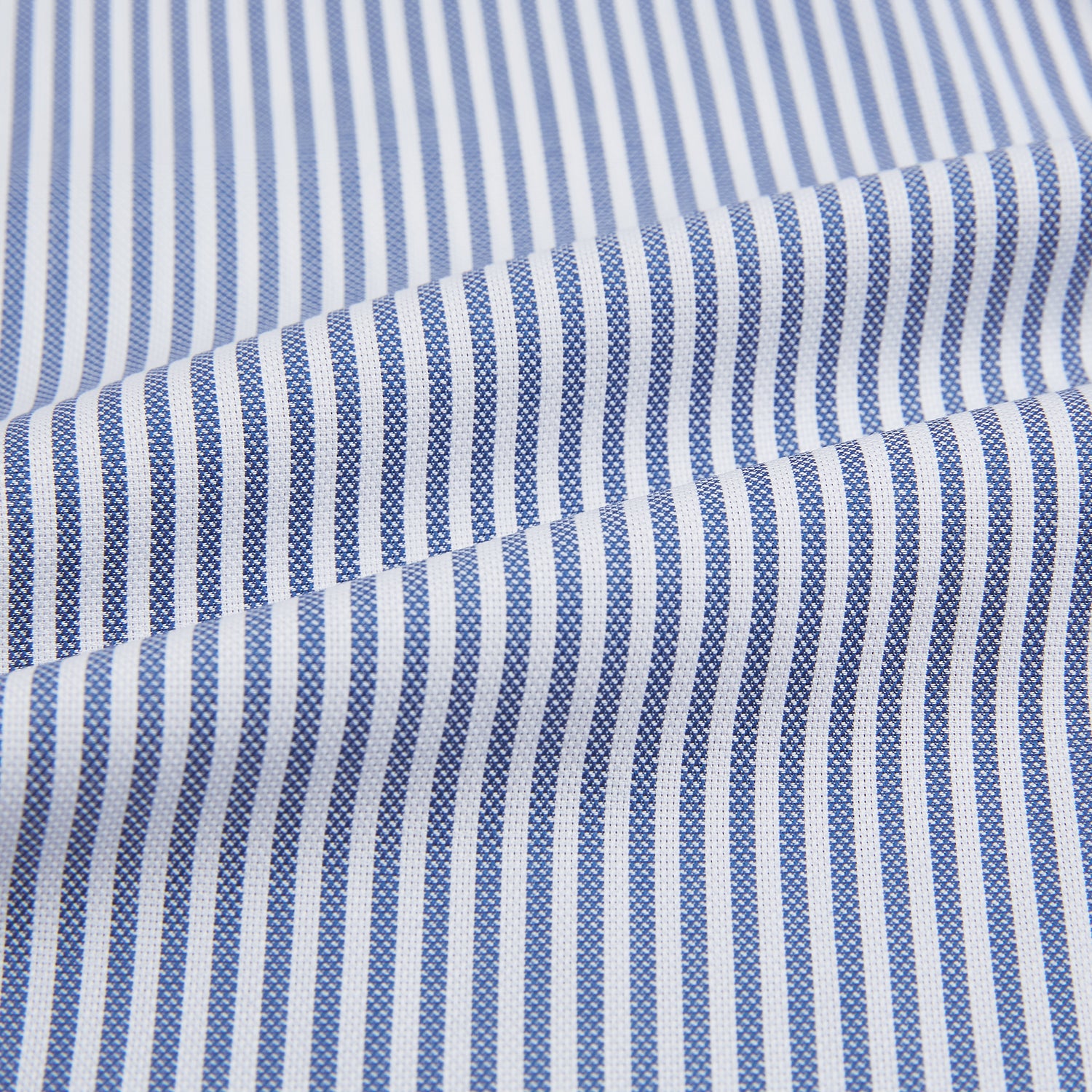 View 6 of product The Turnbull & Asser Navy Bengal Stripe Mayfair Shirt is a long-sleeved, collared formal shirt with blue and white stripes, white buttons, and buttoned cuffs—ideal for classic style enthusiasts. Displayed on a plain white background.