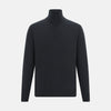 View 1 of product The Turnbull & Asser Smoke Grey Half-Zip Cashmere Jumper features long sleeves, a high collar, and a half-zip design, displayed against a plain white background.