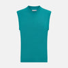 View 1 of product Turnbull & Asser's Turquoise Fine Merino V-Neck Vest features ribbed edges and a sleeveless design, ideal for a refined look, shown against a plain white background.