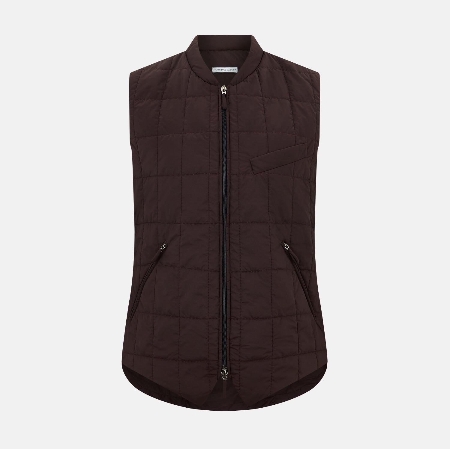 View 1 of product The Turnbull & Asser Burgundy Quilted Gilet is a sleeveless, lightweight layer featuring a front zipper, slanted chest pocket, adjustable side tabs, and two zippered side pockets, shown on a plain white background.